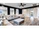 A living room with wood floors, neutral colors and a ceiling fan at 3930 E Enrose St, Mesa, AZ 85205