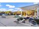 Swimming pool and entertainment area with a pergola covering a dining table at 3930 E Enrose St, Mesa, AZ 85205