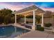 Beautiful pool and pergola with an outdoor kitchen and dining area at 3930 E Enrose St, Mesa, AZ 85205