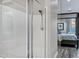 Step into this modern shower with sleek glass doors, offering a clean and luxurious bathing experience in the bathroom at 3930 E Enrose St, Mesa, AZ 85205