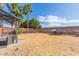 Landscaped backyard with a patio, bench, and trampoline against the back wall at 4325 E Cedarwood Ln, Phoenix, AZ 85048