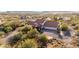 Stunning aerial view of home in desert landscape, with red tile roof and circular driveway at 44434 N 20Th St, New River, AZ 85087