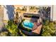 A bird's eye view shows the pool area and garden landscape of this sprawling estate with its terracotta tile roof at 44434 N 20Th St, New River, AZ 85087
