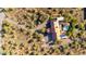 Aerial view of the property showcasing the beautiful home, pool, and mature landscaping at 44434 N 20Th St, New River, AZ 85087