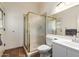 Bathroom featuring a glass-enclosed shower, toilet, and single sink vanity with tile floors at 44434 N 20Th St, New River, AZ 85087