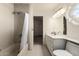 Bright bathroom features a shower/tub combo with neutral tile and a modern vanity at 44434 N 20Th St, New River, AZ 85087