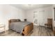 Relaxing bedroom with wood-look floors and ensuite bathroom at 44434 N 20Th St, New River, AZ 85087