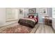 Bedroom with a window seat, a chandelier, hardwood floors and artwork on the wall at 44434 N 20Th St, New River, AZ 85087