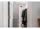 View into closet with clothing and storage at 44434 N 20Th St, New River, AZ 85087