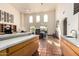 Open-concept dining room featuring terracotta tile floors, high ceilings, modern lighting, and natural light at 44434 N 20Th St, New River, AZ 85087
