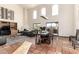 Open-concept dining room featuring high ceilings, terracotta tile floors, and natural light from large windows at 44434 N 20Th St, New River, AZ 85087