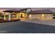 Exterior of home with porte cochere, three-car garage, and a fountain feature at sunset at 44434 N 20Th St, New River, AZ 85087