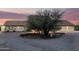 Expansive property showcasing Southwest design, circle drive, and a neutral-toned exterior at sunset at 44434 N 20Th St, New River, AZ 85087