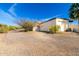 View of the three car garage with low maintenance landscaping at 44434 N 20Th St, New River, AZ 85087