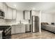 Modern kitchen includes stainless steel appliances and neutral cabinets at 44434 N 20Th St, New River, AZ 85087