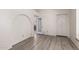 Bright living room features wood floors and a door to the kitchen at 44434 N 20Th St, New River, AZ 85087