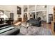 Bright living room featuring high ceilings, terracotta tile floors, and a large window view of the property at 44434 N 20Th St, New River, AZ 85087