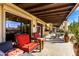 Covered patio has outdoor furniture and a grill at 44434 N 20Th St, New River, AZ 85087