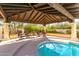 The backyard pool and spa have an adjacent covered patio for dining and relaxation at 44434 N 20Th St, New River, AZ 85087