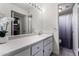 Well-lit bathroom with a white vanity, ample counter space, and a shower at 4444 E Paradise Village N Pkwy # 132, Phoenix, AZ 85032