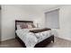 Bedroom with neutral color palette, decorative pillows, and wood-look floors at 4444 E Paradise Village N Pkwy # 132, Phoenix, AZ 85032