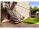 Condo exterior featuring landscaped grounds and convenient staircase access at 4444 E Paradise Village N Pkwy # 132, Phoenix, AZ 85032