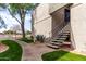 Apartment exterior featuring stairs leading to the second floor, set in a landscaped courtyard at 4444 E Paradise Village N Pkwy # 132, Phoenix, AZ 85032