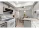 Bright eat-in kitchen showcases light gray cabinets and granite countertops, offering modern functionality and style at 4444 E Paradise Village N Pkwy # 132, Phoenix, AZ 85032