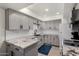 Updated kitchen boasts gray cabinets, granite countertops, and modern appliances, complemented by recessed lighting at 4444 E Paradise Village N Pkwy # 132, Phoenix, AZ 85032