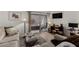 Inviting living room features contemporary decor and a sliding glass door leading to an outdoor space at 4444 E Paradise Village N Pkwy # 132, Phoenix, AZ 85032
