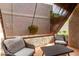 Relaxing covered patio with two chairs and small table, perfect for enjoying the outdoors at 4444 E Paradise Village N Pkwy # 132, Phoenix, AZ 85032