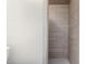 Modern bathroom features a tiled shower with neutral-toned tiles and a sleek design at 4444 E Paradise Village N Pkwy # 132, Phoenix, AZ 85032