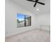 Minimalist bedroom with neutral carpet and large window, offering serene atmosphere at 4748 E Redfield Rd, Phoenix, AZ 85032