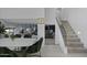 Bright entryway features open staircase, dining area, and living room with sleek fireplace at 4748 E Redfield Rd, Phoenix, AZ 85032