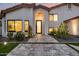Stunning entrance featuring a tiled walkway with an arched entryway and desert landscaping at 4748 E Redfield Rd, Phoenix, AZ 85032