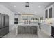 Modern kitchen featuring a large island with seating, stainless steel appliances and plenty of storage at 4748 E Redfield Rd, Phoenix, AZ 85032