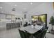 Open kitchen with quartz island, bar stools, and modern appliances, great for entertaining at 4748 E Redfield Rd, Phoenix, AZ 85032