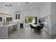 Bright kitchen featuring a waterfall island, stainless appliances and seamless indoor/outdoor transition at 4748 E Redfield Rd, Phoenix, AZ 85032