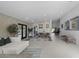 Open-concept living area featuring modern decor, neutral tones and abundant natural light at 4748 E Redfield Rd, Phoenix, AZ 85032