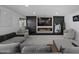 Spacious living room featuring an electric fireplace, large TV, and plush seating at 4748 E Redfield Rd, Phoenix, AZ 85032