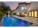 Beautiful backyard with a refreshing pool and elegant landscaping at 4748 E Redfield Rd, Phoenix, AZ 85032