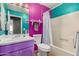 Unique bathroom with colorful walls, vanity, and shower-tub combination at 508 N Sierra Vista Dr, Wickenburg, AZ 85390