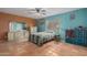 Cozy bedroom with unique decor, a ceiling fan, and tile flooring at 508 N Sierra Vista Dr, Wickenburg, AZ 85390