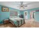 Comfortable bedroom featuring bright walls, tile floors, and a ceiling fan at 508 N Sierra Vista Dr, Wickenburg, AZ 85390