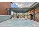 Luxurious hot tub with jets on a patio with a pergola, perfect for relaxation at 508 N Sierra Vista Dr, Wickenburg, AZ 85390