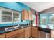Kitchen area featuring updated cabinetry, stainless steel appliances, and a convenient layout at 508 N Sierra Vista Dr, Wickenburg, AZ 85390