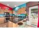 Inviting kitchen with stainless steel appliances, counter seating, and access to the outdoor space at 508 N Sierra Vista Dr, Wickenburg, AZ 85390
