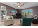 Cozy living room with a fireplace, tiled floor, and comfortable seating arrangement at 508 N Sierra Vista Dr, Wickenburg, AZ 85390