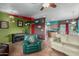 Bright living room with piano, seating, and colorful walls leading to kitchen at 508 N Sierra Vista Dr, Wickenburg, AZ 85390