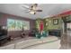Inviting living room featuring a large window, tiled floors, and an open layout at 508 N Sierra Vista Dr, Wickenburg, AZ 85390
